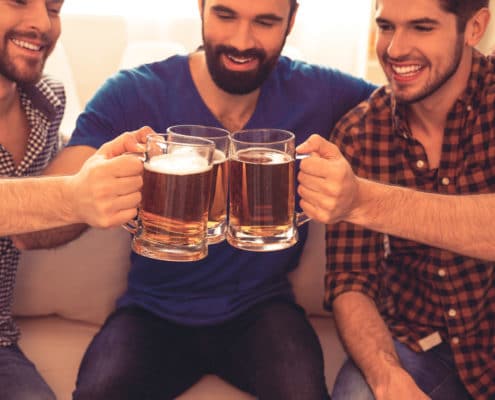 three guys drinking beer